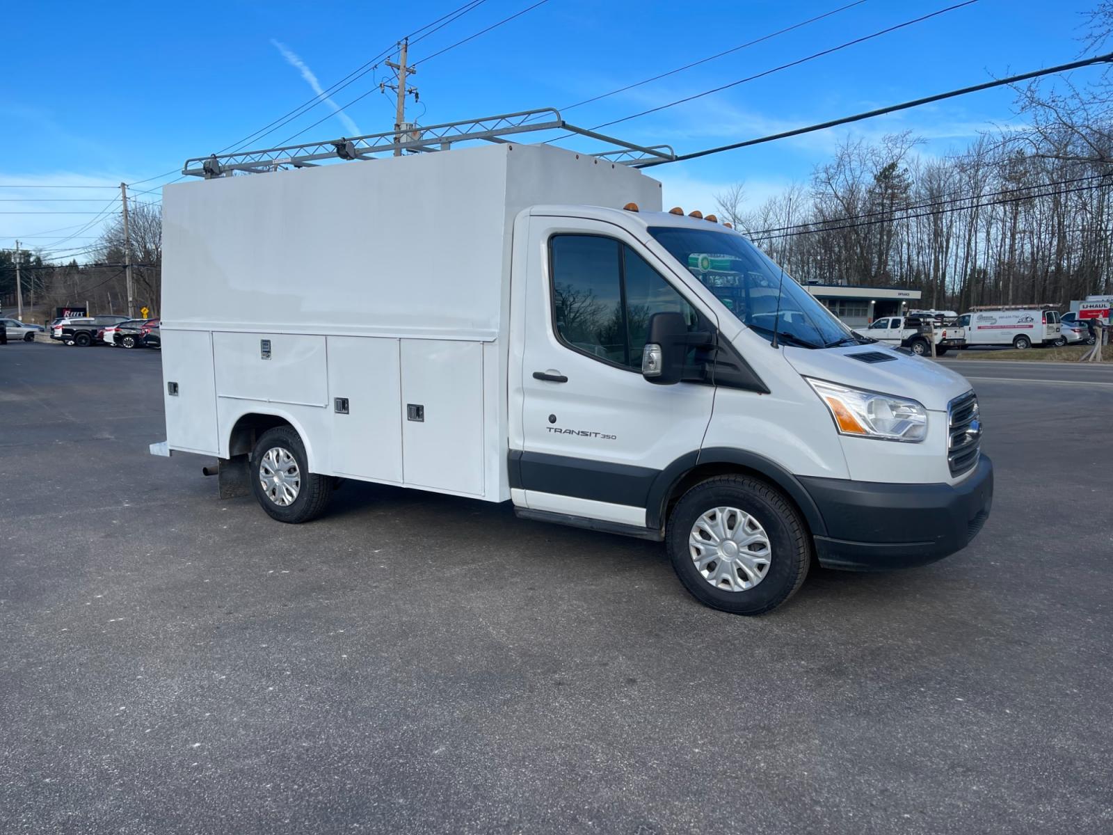 2018 White /Black Ford Transit T-350 (1FDBW5PM5JK) with an 3.7L V6 DOHC 24V engine, 6 Speed Automatic transmission, located at 11115 Chardon Rd. , Chardon, OH, 44024, (440) 214-9705, 41.580246, -81.241943 - This 2018 Ford T-350 Cutaway with a utility box is a versatile commercial vehicle powered by a 3.7-liter V6 engine. It's equipped with a 4.10 gearing ratio and a limited-slip rear differential, which helps to improve traction and handling under various conditions. This model boasts substantial hauli - Photo #3